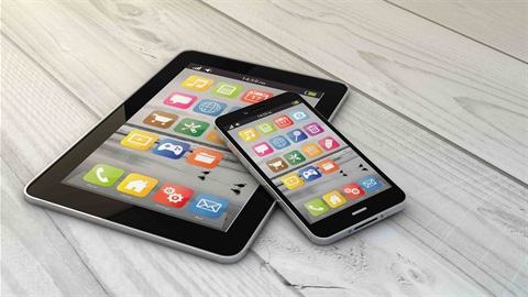 Phone laying on top of a iPad.